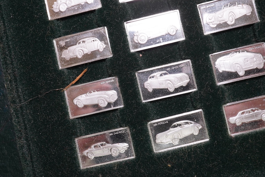 A cased set of one hundred 925 ingots, each depicting a different car model, each 27mm and weighing approximately 1.6 grams. Condition - good